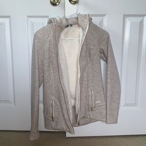 Athleta coat with fur inside. Has pockets and a zipper.